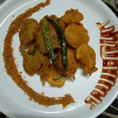A picture of Potato and carom leaves fritters.