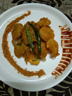 A picture of Potato and carom leaves fritters.