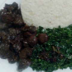 Fried beef kidney,liver,skumawiki and ugali A picture of Fried beef kidney,liver,skumawiki and ugali.