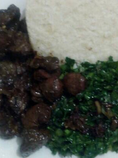 A picture of Fried beef kidney,liver,skumawiki and ugali.