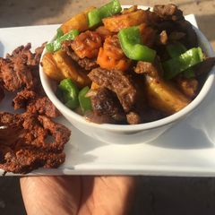 A picture of Stir fried Potato, vege & meat.