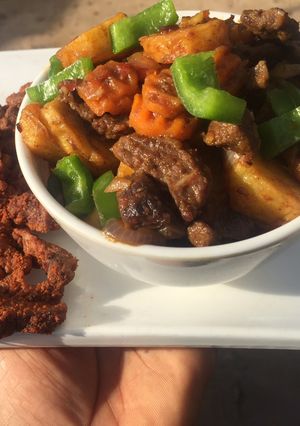 A picture of Stir fried Potato, vege & meat.