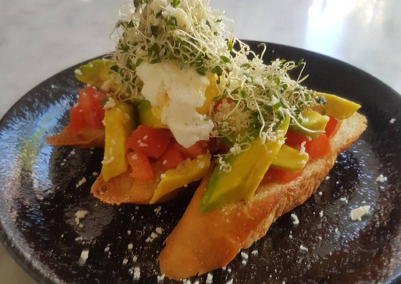 Avomato Bruschetta With Poached Egg And Alfalfa