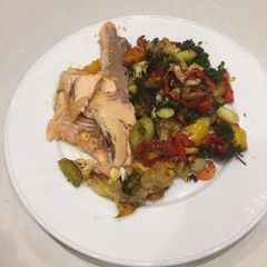 A picture of Baked trout and vegetables.