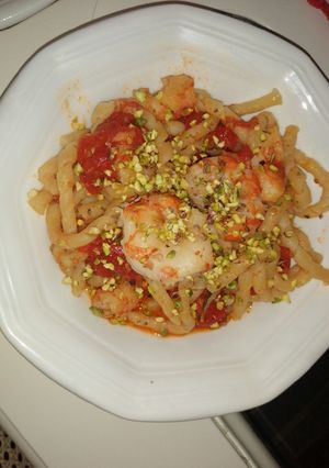 A picture of Busiate with Piccadilly Tomatoes, Shrimp, and Crushed Pistachios.