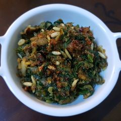 A picture of Spinach-pine nuts (palak chilgoza).