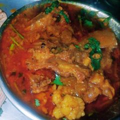 A picture of Papaya mutton curry with Bengali style.