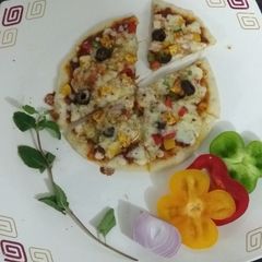A picture of Paneer Mix Veg Pizza Thin Crust.