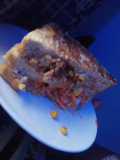 A picture of Chicken and Sardine Club Sandwish.