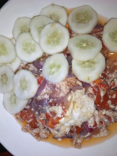 A picture of Fried eggs with cucumber.