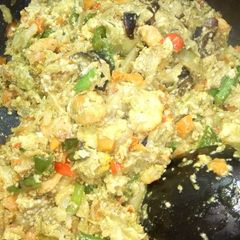 A picture of Garden egg and plantains with veggies.