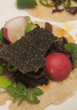 A picture of Black vinegar mushroom tacos.