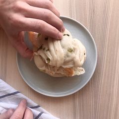 A picture of Spring onion bun with pan fried egg 🍳.