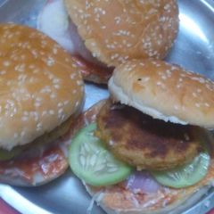 A picture of Burger with aloo tikki.