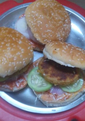 A picture of Burger with aloo tikki.