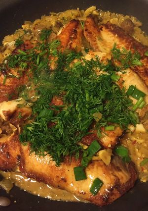 A picture of Fillet Fish with White Wine and Mushroom Sauce.