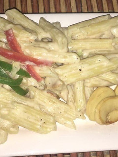 A picture of Alfredo mushroom penne pasta.