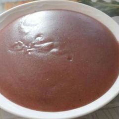 A picture of Sour porridge of a mixture of millet, sorghum and ground nuts.