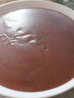 A picture of Sour porridge of a mixture of millet, sorghum and ground nuts.