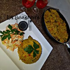 A picture of Chinese fried rice,coleslaw and chapman.