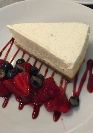 A picture of Cheese cake with berry compote.