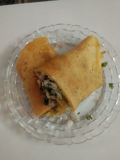 A picture of Paneer stuffed moong dal chilla.