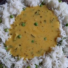 A picture of Jeera Rice with kadhi.
