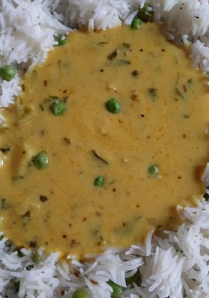 A picture of Jeera Rice with kadhi.
