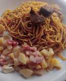 Jollof spaghetti with beef and potato salad