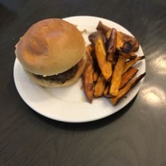 A picture of Sweet Thai chili burgers with ginger scallion aioli,crispy onions & sweet potato wedges.