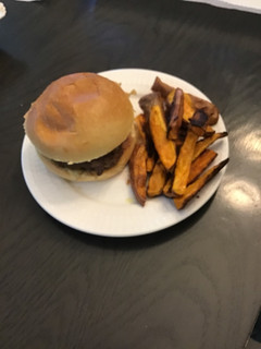A picture of Sweet Thai chili burgers with ginger scallion aioli,crispy onions & sweet potato wedges.