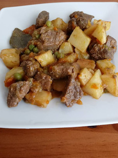 Una foto de Carne compuesta estilo canario