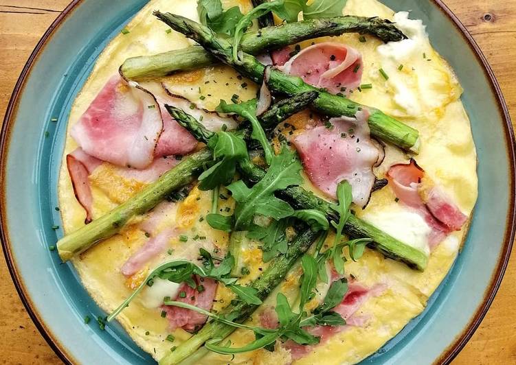 Baked omelette with ham, Langres cheese and grilled asparagus