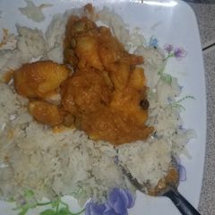 A picture of Rice and thick stew.