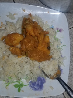A picture of Rice and thick stew.
