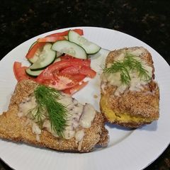 Brad's cheesy corn fried cod w/ pickled cucumber & tomato salad A picture of Brad's cheesy corn fried cod w/ pickled cucumber & tomato salad.