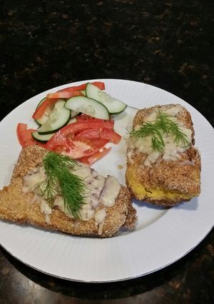 A picture of Brad's cheesy corn fried cod w/ pickled cucumber & tomato salad.