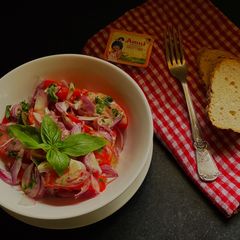 A picture of Tomato Salad with Anchovy vinaigrette.