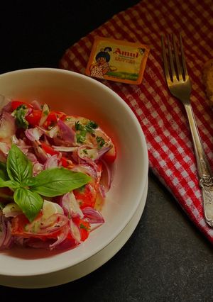 A picture of Tomato Salad with Anchovy vinaigrette.