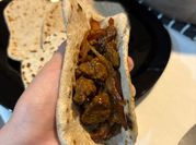 Una foto de relleno de carnes para rapiditas