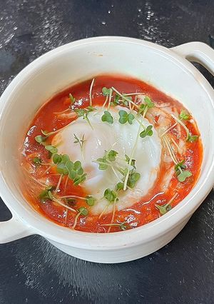 A picture of Freddy’s Poached egg with a sweet pepper sauce.
