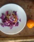 Purple cabbage salad with grilled chicken breast, feta, and citrus dressing