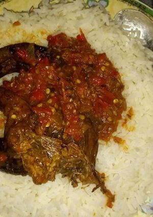 A picture of Rice and eja dudu stew.