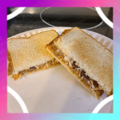 Peanut butter and coconut sandwich with chocolate A picture of Peanut butter and coconut sandwich with chocolate.