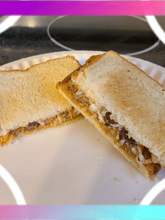 A picture of Peanut butter and coconut sandwich with chocolate.