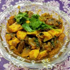 A picture of Boiled egg onion curry.