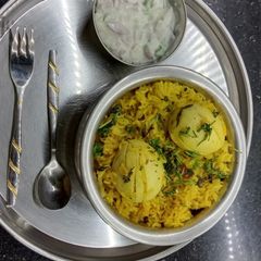 Egg briyani with onion raita A picture of Egg briyani with onion raita.