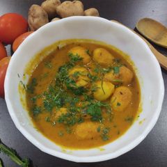 A picture of Roasted baby potatoes gravy.