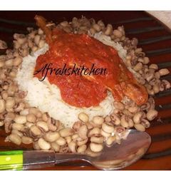 A picture of Rice and beans with stew.