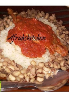 A picture of Rice and beans with stew.